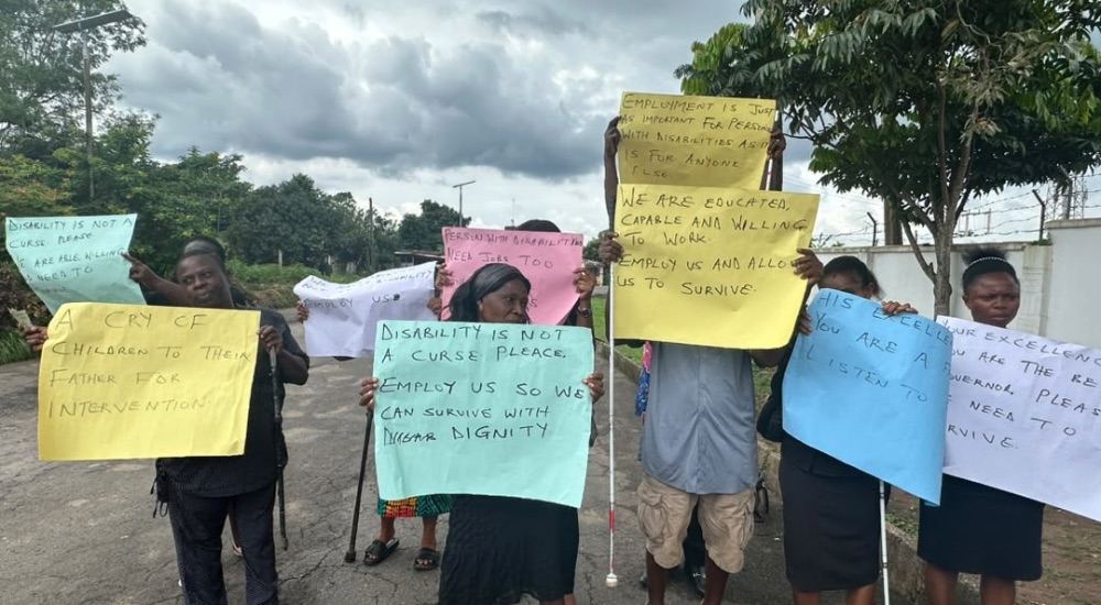Abia PWDs Protest Exclusion from Teacher Recruitment as Disability Commission Promises Justice Protesting Persons With Disabilities with Placards